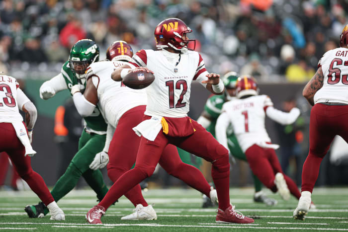 Washington Commanders quarterback Jacoby Brissett (12) throws the ball during the second half against the New York Jets at MetLife Stadium.